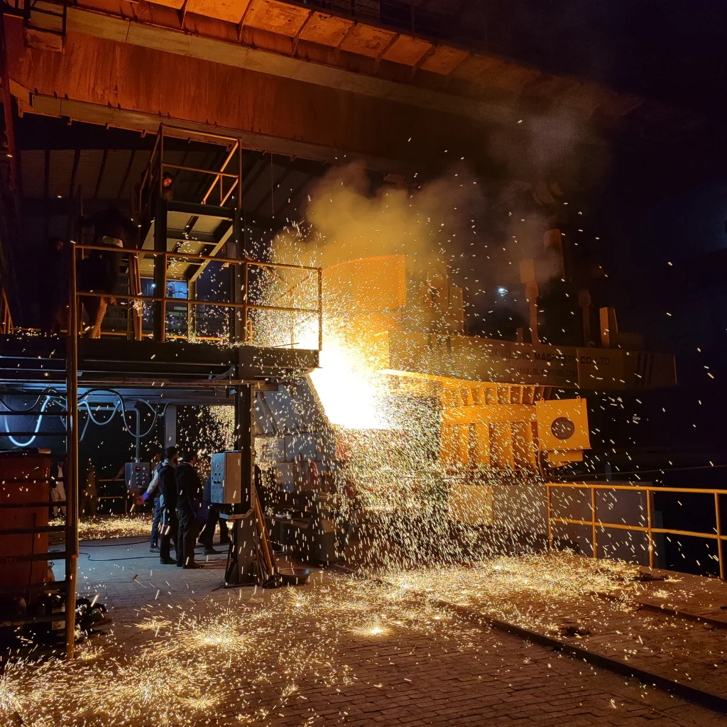 image of molten steel being poured into tundish from ladle turret